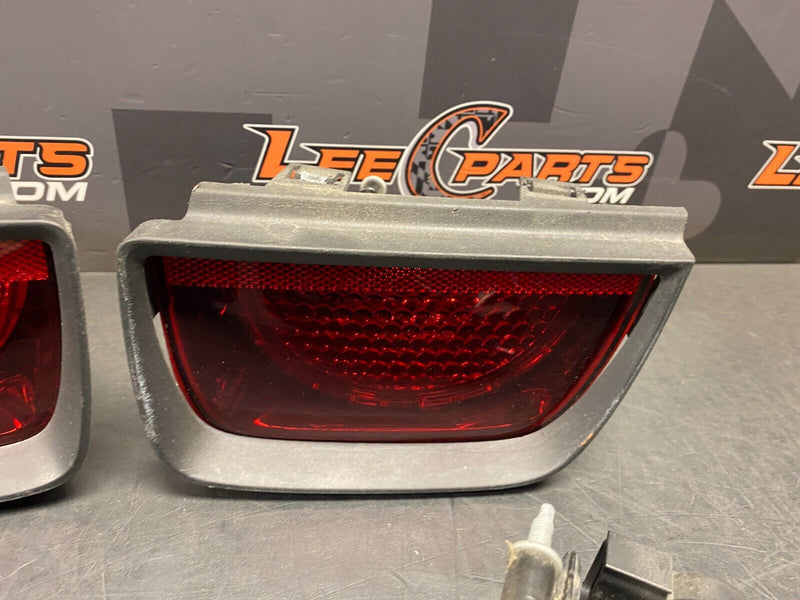 2010 CHEVROLET CAMARO SS OEM TAIL LIGHT ASSEMBLY WITH TRIM RING BEZELS USED