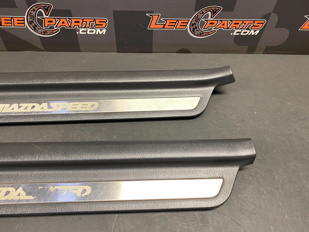 2003 MAZDASPEED PROTEGE OEM SIDE SILL KICK PANELS PAIR DR PS USED